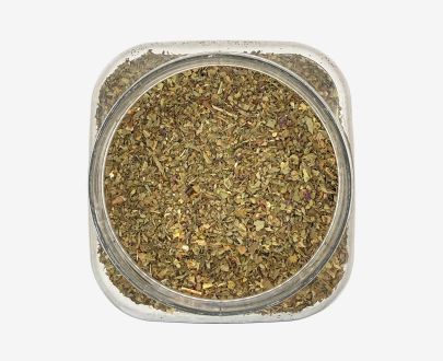 Vista superior de un bote formato hostelería HoReCa de hojas de albahaca trituradas que muestra el producto en su interior, conservando todo su aroma y frescura.